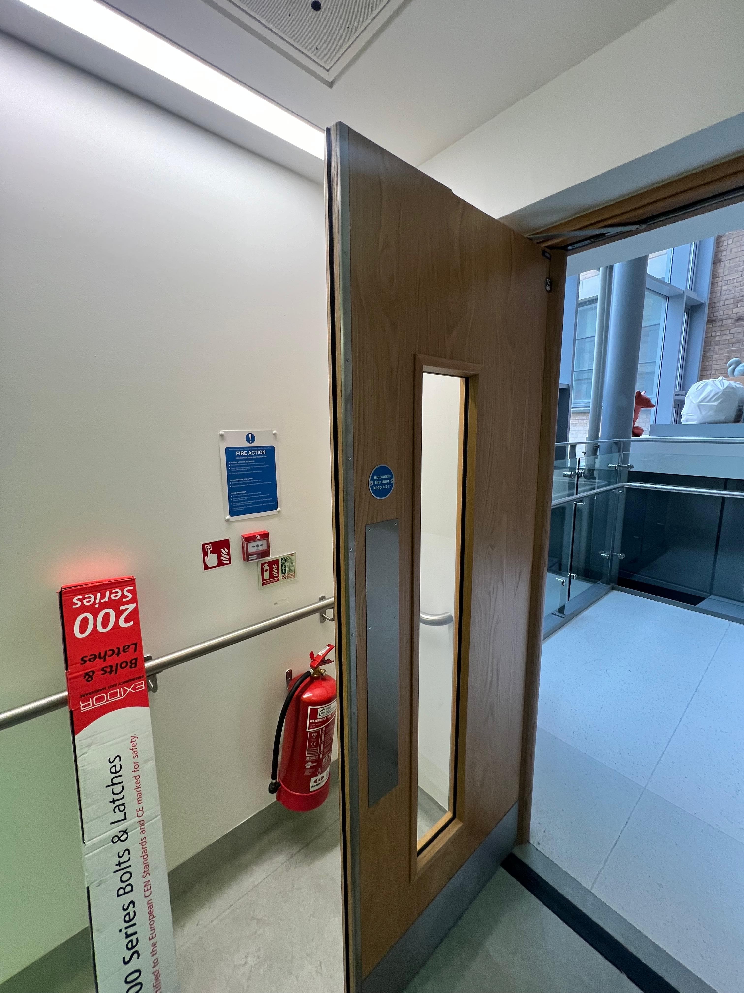 Fire door hinge and intumescent seal under technical inspection